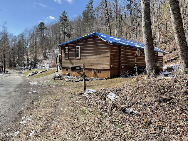 view of side of home with crawl space