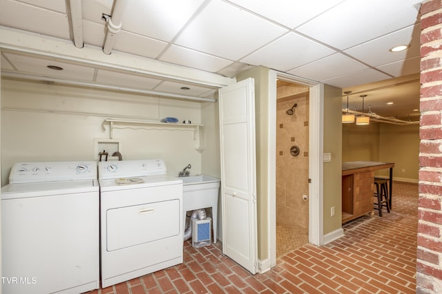 laundry area featuring washing machine and clothes dryer