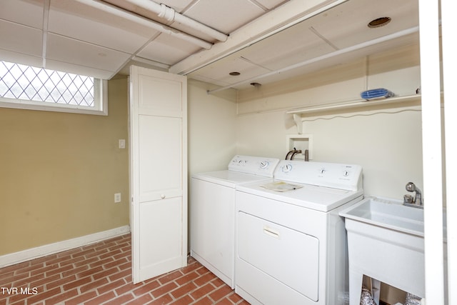 laundry area with sink and independent washer and dryer