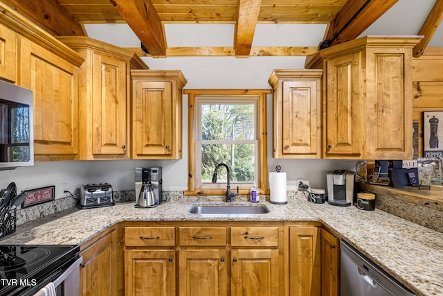 kitchen with beamed ceiling, stainless steel appliances, light stone countertops, and sink