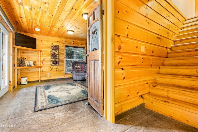 interior space featuring wooden walls and wood ceiling