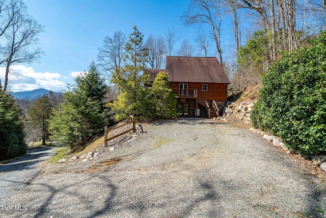 view of side of home featuring a mountain view