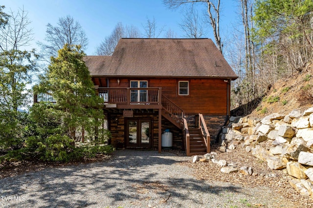 exterior space featuring french doors and a deck