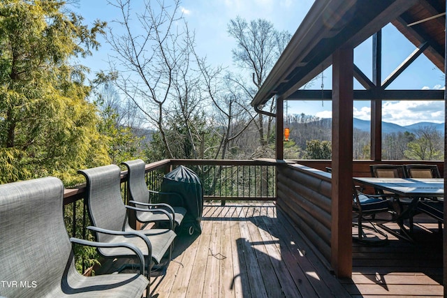 wooden terrace with a mountain view