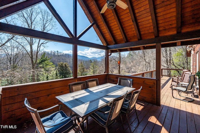 wooden terrace with ceiling fan and a mountain view