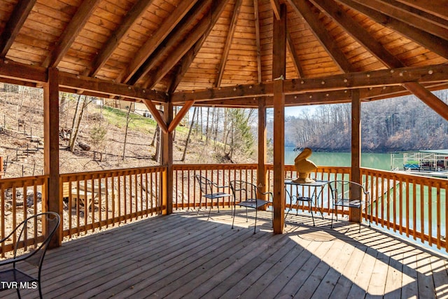 deck with a gazebo and a water view