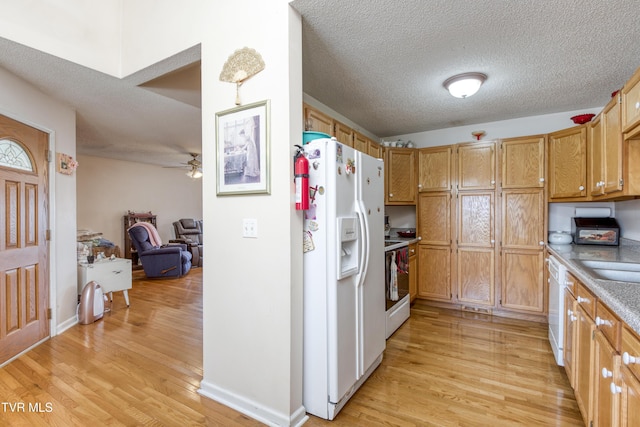 kitchen featuring ceiling fan, a textured ceiling, white appliances, and light hardwood / wood-style flooring