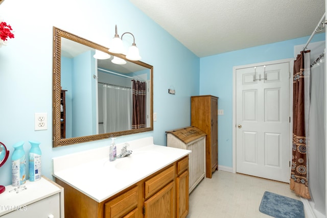 bathroom with vanity and a textured ceiling