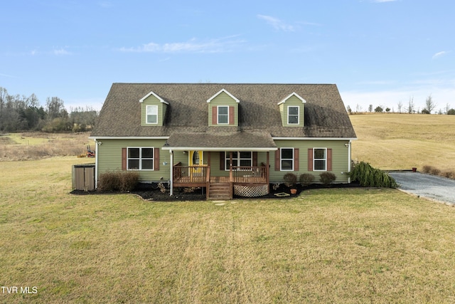 new england style home with a front yard