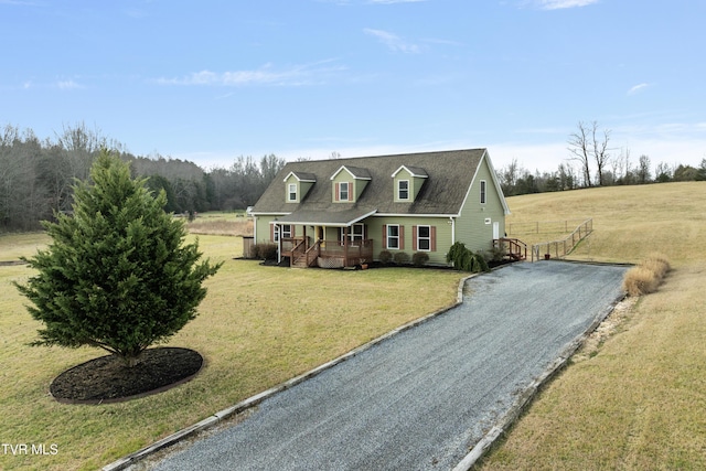 cape cod-style house with a front lawn