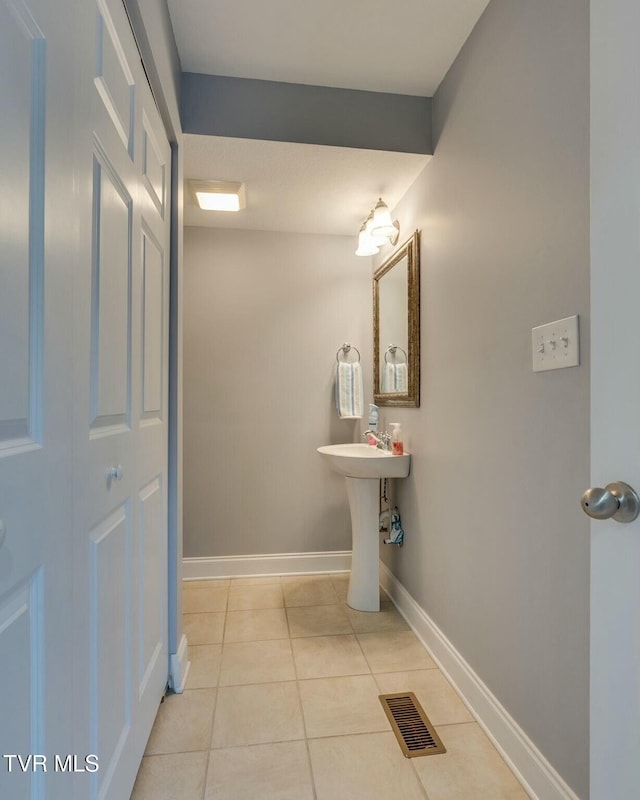 bathroom with tile patterned flooring