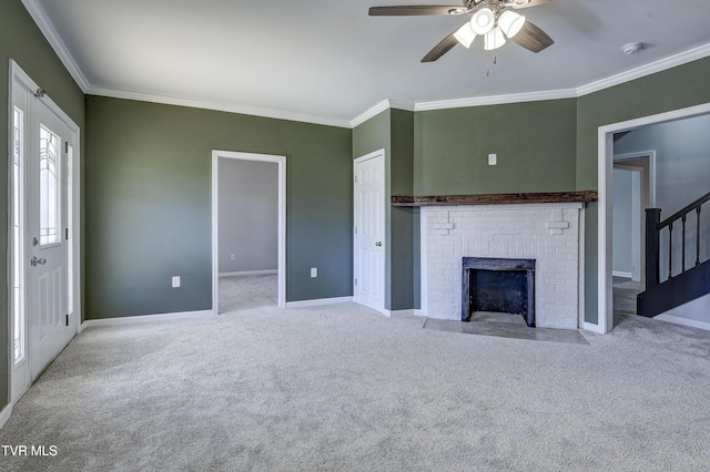 unfurnished living room with light carpet, a brick fireplace, crown molding, and ceiling fan