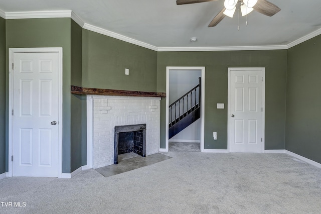 unfurnished living room with ceiling fan, light colored carpet, ornamental molding, and a brick fireplace