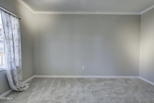 unfurnished room with light colored carpet and ornamental molding