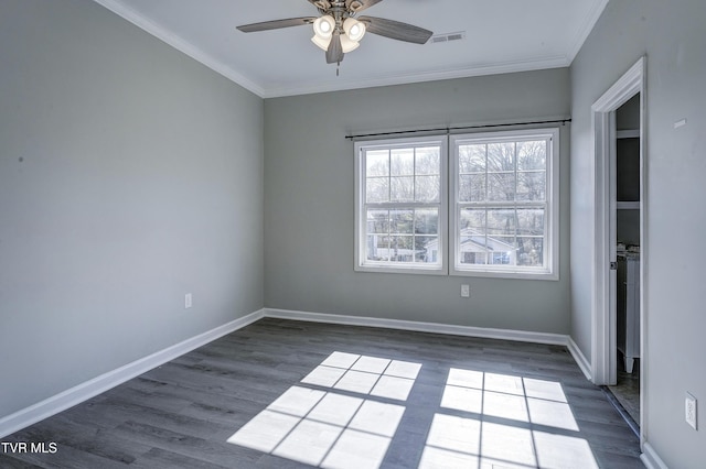 spare room featuring crown molding, ceiling fan, and dark hardwood / wood-style floors