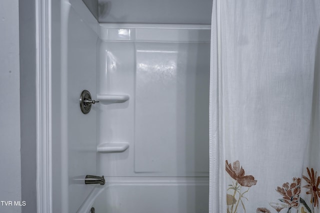 bathroom with bathing tub / shower combination