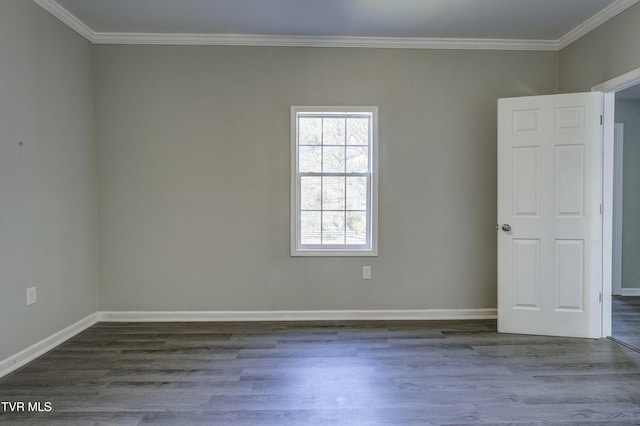 unfurnished room with ornamental molding and dark wood-type flooring