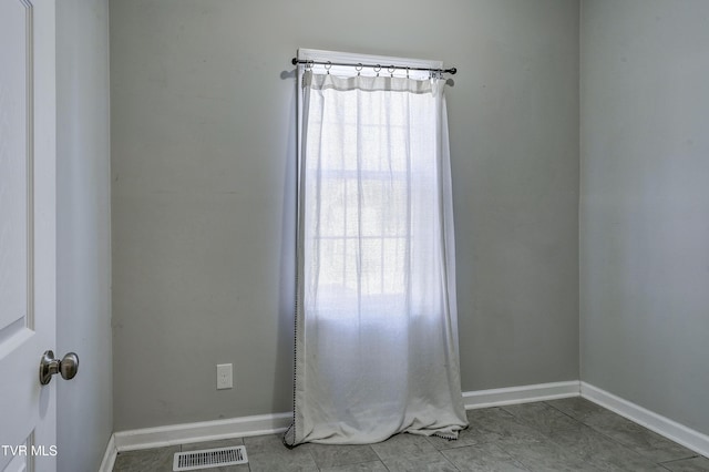 view of tiled spare room