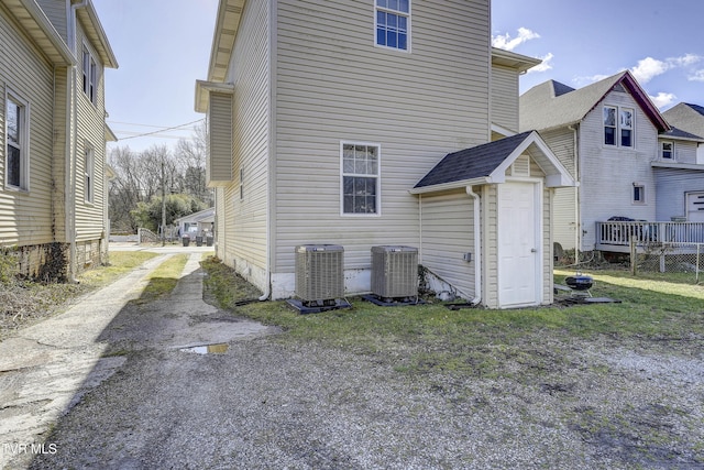 rear view of property with central air condition unit