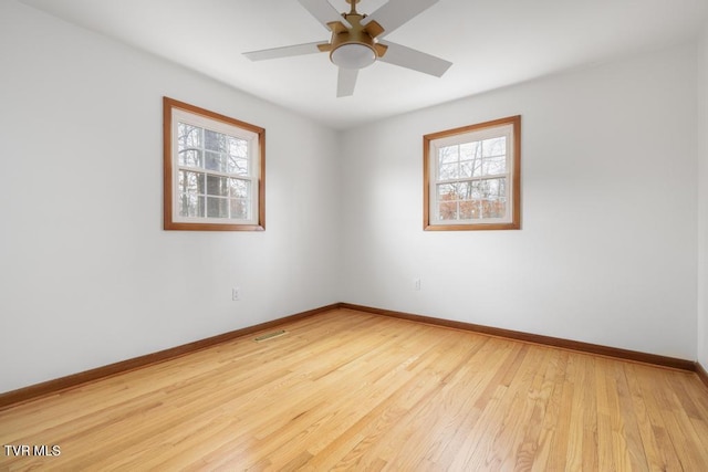 unfurnished room with light hardwood / wood-style flooring and ceiling fan