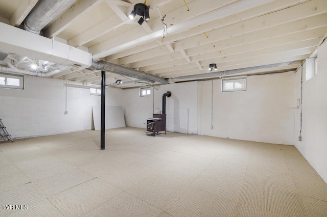 basement featuring a wood stove