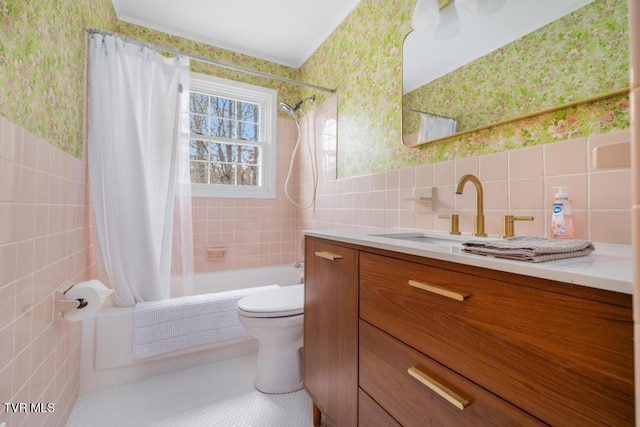 full bathroom featuring tile patterned floors, toilet, tile walls, vanity, and shower / bath combo with shower curtain