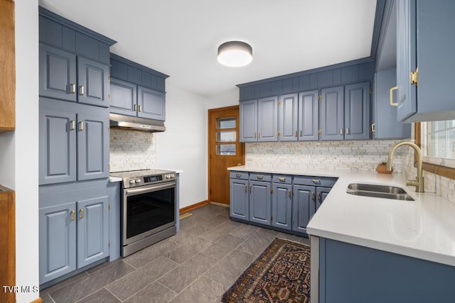 kitchen featuring electric stove, sink, and blue cabinets