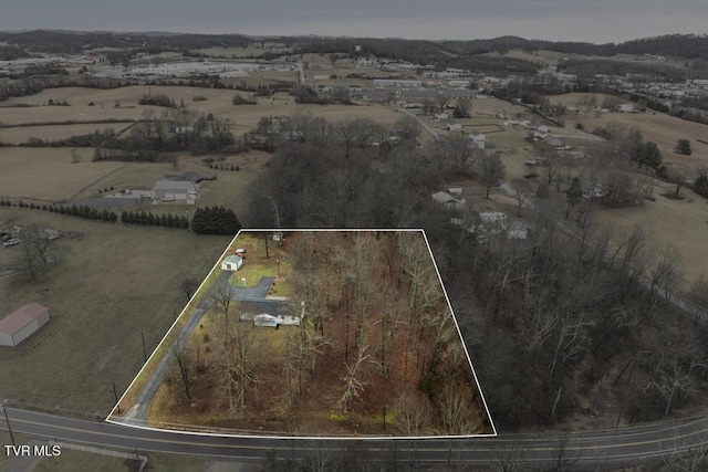 birds eye view of property featuring a rural view