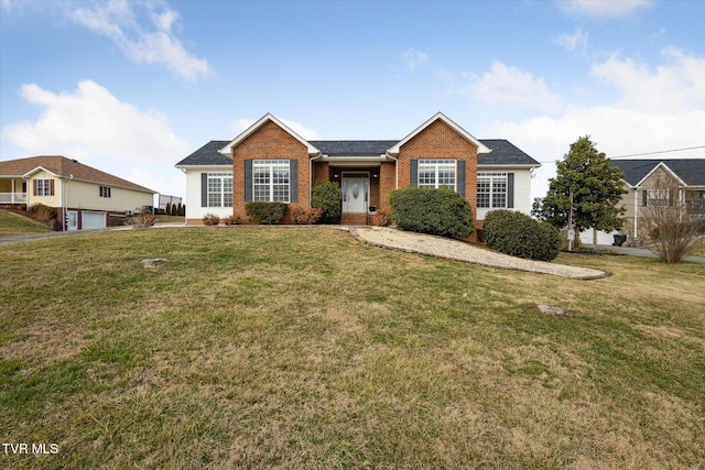 single story home with a garage and a front lawn