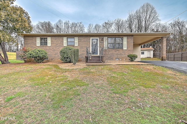 ranch-style house with a front lawn and a carport