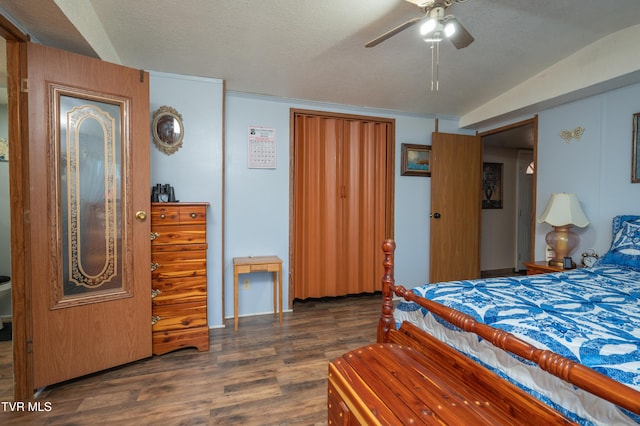 bedroom featuring dark hardwood / wood-style flooring and a textured ceiling