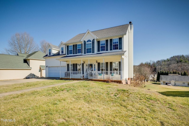 colonial inspired home featuring a porch and a front lawn