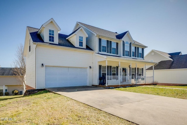 view of front facade featuring a garage, a front lawn, and covered porch