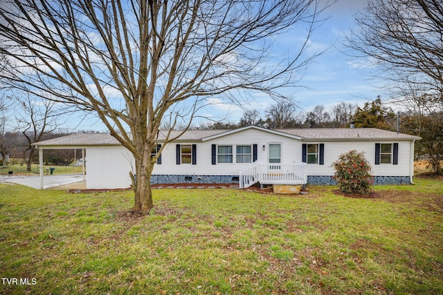 view of front of home with a front lawn and a carport