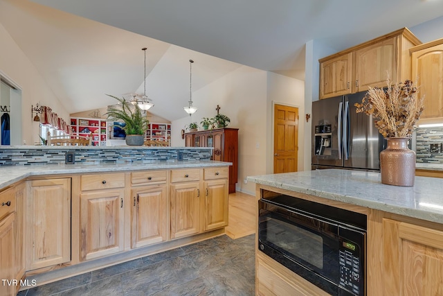 kitchen featuring pendant lighting, light brown cabinetry, stainless steel fridge, decorative backsplash, and light stone countertops