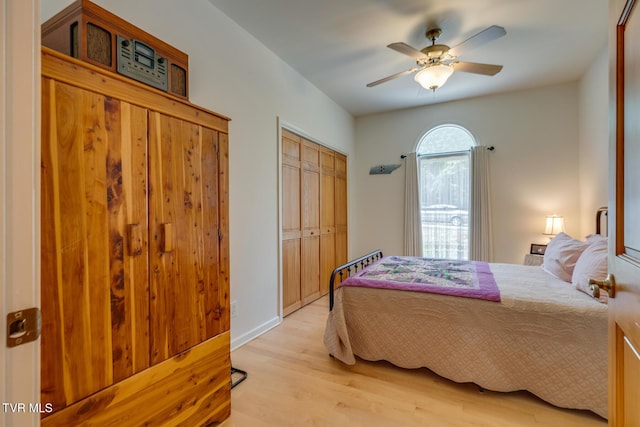 bedroom with light hardwood / wood-style flooring and ceiling fan