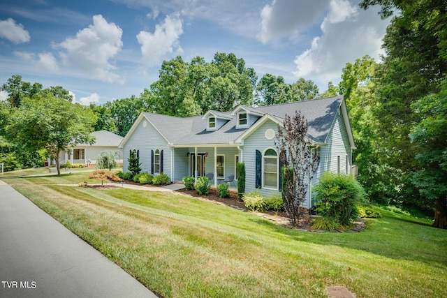 view of front of house with a front yard and a porch