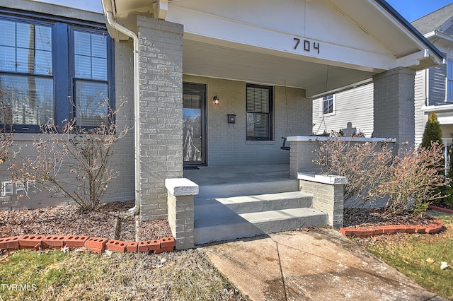 doorway to property featuring a porch