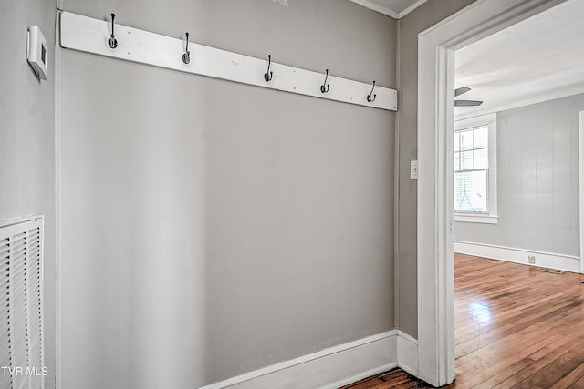 mudroom with wood-type flooring