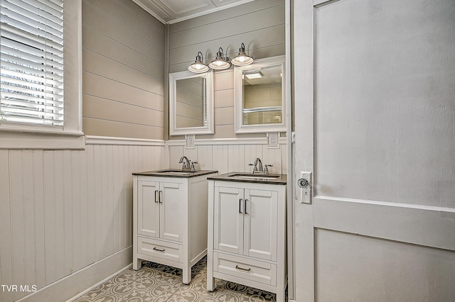 bathroom with tile patterned floors, vanity, and wood walls