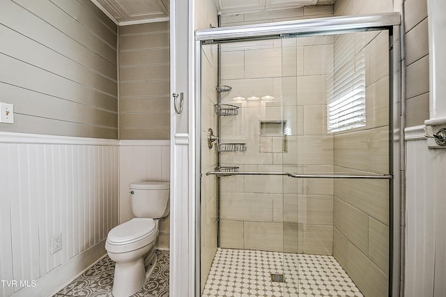 bathroom featuring walk in shower, toilet, and tile patterned flooring