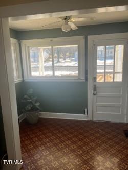 entryway featuring a healthy amount of sunlight and ceiling fan