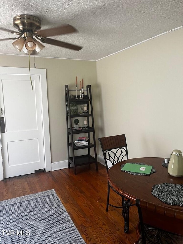 office area featuring ceiling fan, dark wood-type flooring, and a textured ceiling