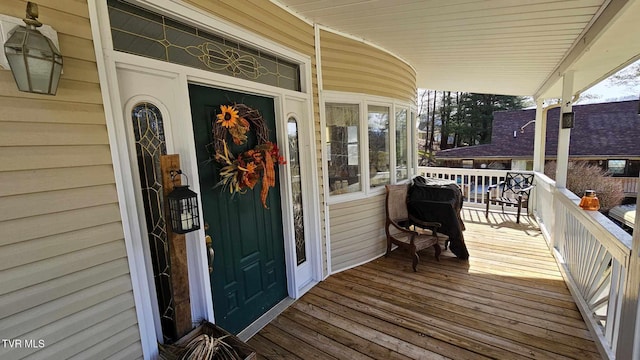 entrance to property with a porch