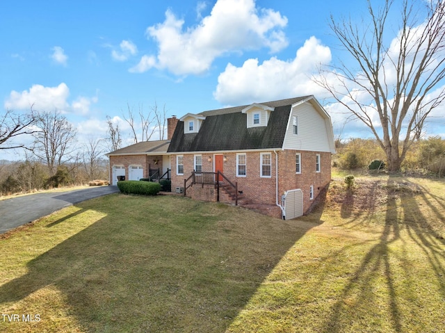 view of front of house featuring a garage and a front yard