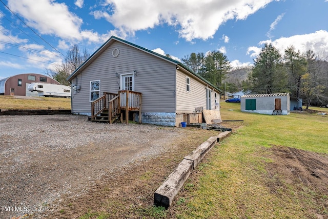 exterior space featuring an outbuilding and a yard