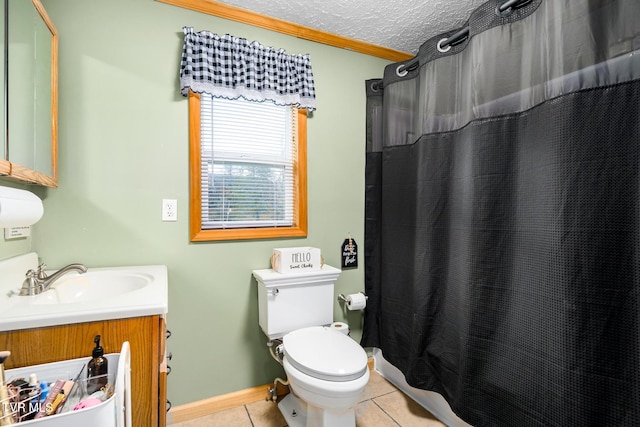 bathroom featuring tile patterned flooring, vanity, toilet, crown molding, and a textured ceiling