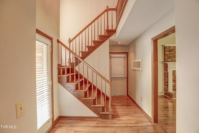 205 Donegal Way Unit 205, Bristol, TN 37620 - staircase featuring baseboards, a high ceiling, and wood finished floors