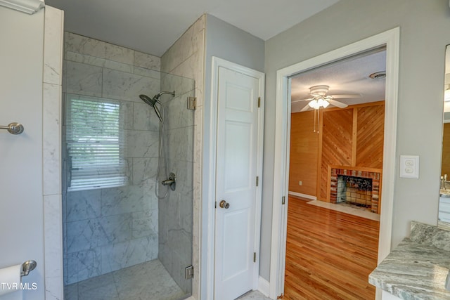205 Donegal Way Unit 205, Bristol, TN 37620 - full bathroom with a stall shower, wood walls, ceiling fan, and wood finished floors