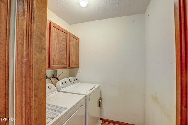 205 Donegal Way Unit 205, Bristol, TN 37620 - laundry room featuring washing machine and dryer, a textured ceiling, cabinet space, and baseboards
